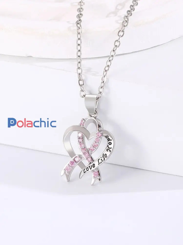 Sensibilisation au cancer du sein des femmes Collier ruban rose comme image / ONE