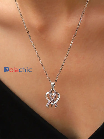 Sensibilisation au cancer du sein des femmes Collier ruban rose comme image / ONE