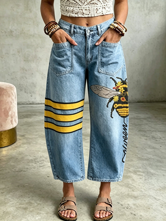 Pantalon à poches avec impression artistique de femmes et d’abeilles